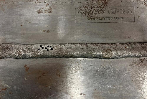 Weld plate CWI-3235 showing visible porosity defects and surface discontinuities used as test specimen for TFM and ECA comparison